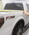 Worker applying Pre-Taped Masking Film With Built-In Three Quarters Inch Tape, 0.5 Mil Thick Protective Film on truck for paint protection