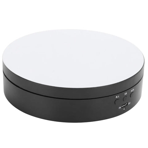 Electric Rotating Display Stand with black base and mirror top, USB powered, showcasing jewelry or cosmetics. Upgrade Your Game With This Sick Electric Rotating Display Stand Boasting 3 Speeds And 4 Adjustable Angles For Showcasing Jewelry Watches And Cosmetics Like A Boss On A Sleek Black Mirror Surface Turntable Base.