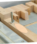 ProLevel Wood Biscuit Joiner And Tenon Slotting Tool delivering nailed down precision on a wooden panel for tight joints.