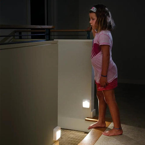 Child standing near Battery Powered Motion Sensing LED Night Light Stick Anywhere White Six Pack Auto On Up To 15 Feet With 120 Degree
