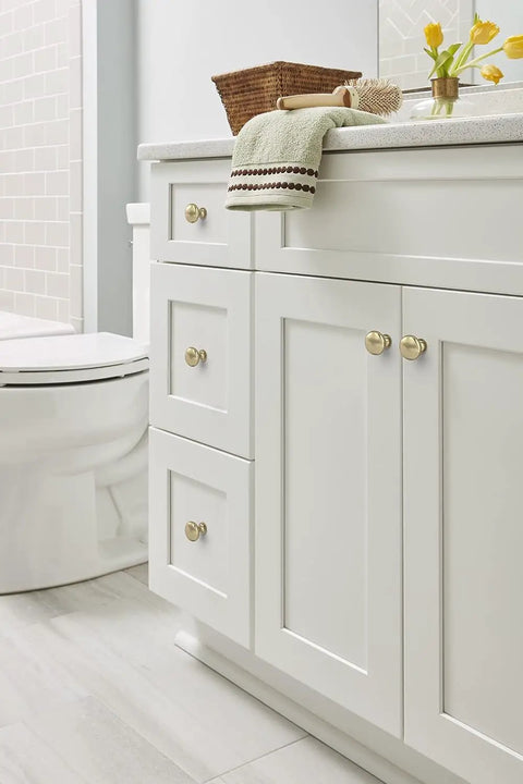Ten Pack 1 1 4 Inch Round Cabinet Knobs Finished In Premium Golden Champagne Tone For Traditional Kitchen Drawers And Furniture Heavy Duty Build With Slick Dimpled Grip And Top Notch Straight Up Classy Charm used on white bathroom cabinetry.