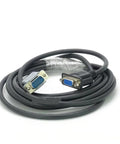 Close-up of a coiled black shielded serial cable with blue DB9 and DB15 connectors.