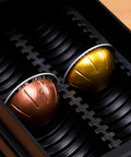 Close-up of 4 Tier Coffee Pod Drawer Organizer For Nespresso VertuoLine Pods, holding two big Vertuo pods, metal frame.