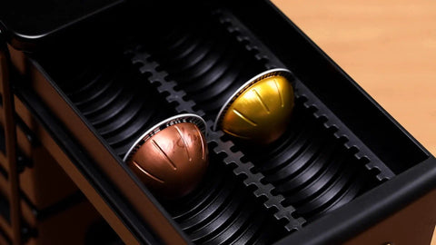 Close-up of 4 Tier Coffee Pod Drawer Organizer For Nespresso VertuoLine Pods, holding two big Vertuo pods, metal frame.