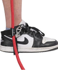 Foot Ascender Gear For Climbing And Rappelling Lightweight Aluminum Alloy attached to shoe with red rope