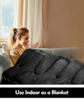Woman using Two Person Sleeping Bag For All Seasons With Wraparound Zippers, Easily Splits Into Two Individual Bags as a blanket