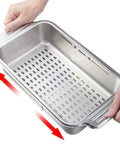 Hands demonstrating Extendable Over Sink Colander In Stainless Steel, adjustable width, heavy-duty SUS 304, strainer basket