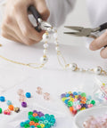 Person crafting jewelry with beads, Clear 3 By 3 Inch Reclosable Zip Bags Pack Of 1200 2 Mil Thick Food Safe Poly Bags visible on side.