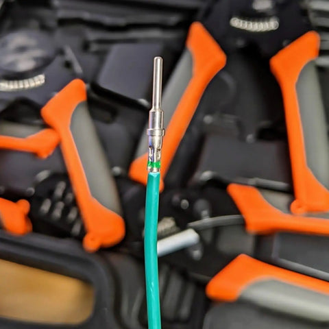 DT Connector Pin And Socket Kit Pro Grade 60 Pieces 30 Pairs Size 16 Terminals in focus with tools in background