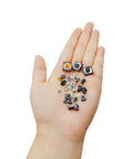 Hand holding Maker Friendly Assorted Micro Momentary Tactile Push Button Switch Kit With 375 Pieces And 26 Values