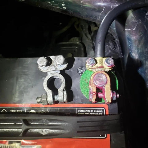 Beefy Brass Battery Terminals Top Post Connectors Clamps Set installed on a car battery for marine and RV use.