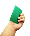 Hand holding 11 Piece Large PCB Board Kit In 4 Sizes 10X22 Cm 15X9 Cm 9X7 Cm 7X5 Cm Blank Prototype Boards Tin Plated