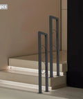 Rock Solid Heavy Duty U Shaped Stair Handrail Featuring Kickstand Style Widened Base And Weatherproof Zinc Coating For Bulletproof Balcony Guardrails And Wide Indoor Steps in black on stairs.