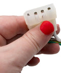 Close-up of hand holding plug connector from Model Specific Refrigerator Ice Maker Assembly Replacement 120V 8 Cube With Harness.