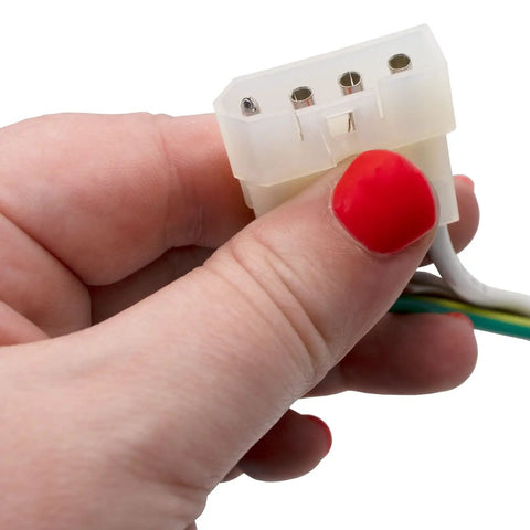 Close-up of hand holding plug connector from Model Specific Refrigerator Ice Maker Assembly Replacement 120V 8 Cube With Harness.