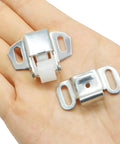 Hassle Free Replacement Nylon Roller Mailbox Catch Latch With Spring Loaded Mechanism And Heavy Duty Iron Construction for cabinet use, shown in hand.