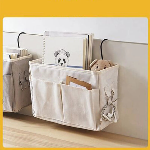 Cotton Linen Nightstand Hanging Bag with Metal Bracket and Multiple Pockets for Bunk Beds showing books and teddy bear