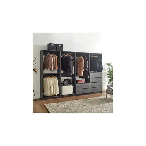 Freestanding Gray Wood Closet System With Five Modular Wardrobe Units For No Stress Setup Clean Vibes Ultimate Storage Flex Super Easy Game Changing Room Layout organized with hanging garments and drawers.
