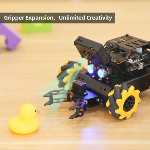 Arduino Compatible Smart Robot Car With AI Vision Camera And Line Tracking For Target Recognition And Obstacle Avoidance STEM Educational Kit For Advanced Projects Programmable Auto Robot Set displayed on table interacting with rubber duck.