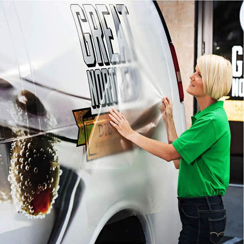Woman applying clear adhesive vinyl to a van, illustrating Clear Contact Paper 17.7 Inch Wide 118 Inch Long Peel And Stick Self Adhesive Vinyl For Cricut Transfers Transparent Book Covers Removable Wallpaper Roll DIY Friendly Waterproof Surface Protector.