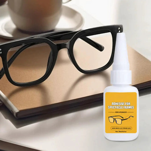 Glasses Repair Glue For Instant Bonding Of Eyeglass Frames With A Fine Tip Applicator beside black eyeglass frames on table