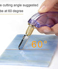 Professional Pistol Grip Oil Feed Glass Cutter With Tungsten Carbide Wheel Stained Glass Cutting Tool cutting stained glass at 60 degrees.