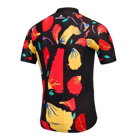 Colorful short-sleeve cycling jersey with abstract floral patterns on a black background, viewed from the back.