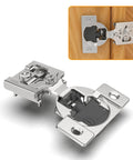 Close-up of concealed 1/2 in overlay hinge with mounting plate; satin-nickel finish, 4D soft-close; install inset.