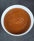 Top view of Orange Hub Grease EP0 Semi Fluid for Trailer Wheel Ends Polyurea Formula 35Lb Bucket in white container