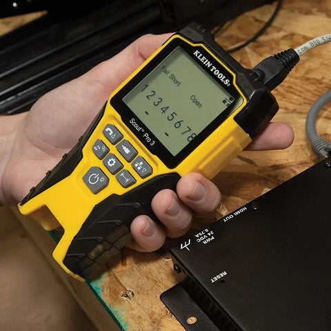 Hand using Versatile On The Go Cable Tester Kit with Scout Pro 3 for Ethernet data coax video and phone cables Starter Edition