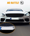 License Plate Screw Kit For Front And Back Plates On Cars SUVs And Trucks Black Zinc Plated Rust Proof And Anti Rattle Bolts Set Of Eight For Quick No Hassle Secure Mounting installed on a white car with close-up view
