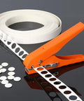 Badass Eight Mm Handheld Hole Punch And Countersink Drill Set With Smooth Adjustment Lever Rugged Iron Build, showcasing orange punch with white paper.