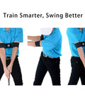 Man using Golf Grip Trainer 2 Pack with Swing Correcting Arm Band for consistent swings on practice kit