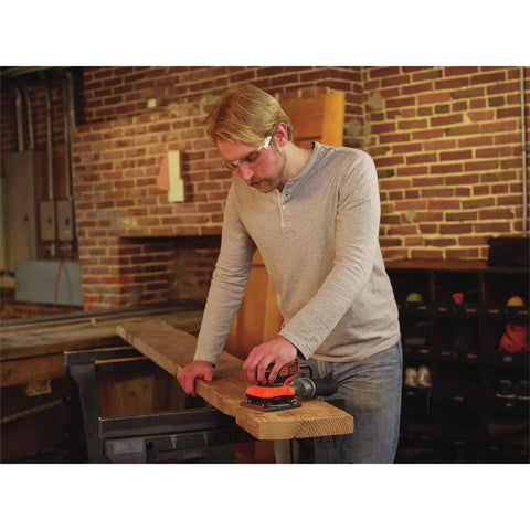 Man using Powerful Two Point Zero Amp Orbit Sander For Serious Finish Work On Wood Metal And Plastic One Hand Use With Slick Soft Paddle Switch