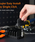 Hand installing a piece of a Magnetic Plier Organizer Set 24-Piece Modular Tool Holders for Toolbox and Drawer Storage, black color.
