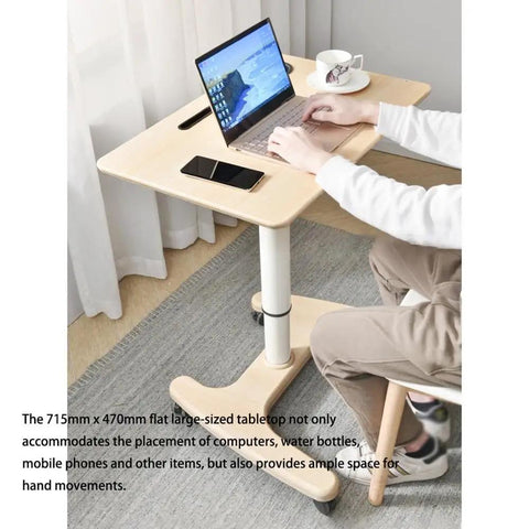 Smooth Operator Pneumatic Rolling Standing Desk With Pro Grade Swivel Casters For Home Office Laptop Workstation Quick Height Flex Deep Wood Grain Finish showing a laptop on a large tabletop.