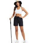 Model wearing Women's Athletic Hiking Running Shorts With Pockets Lightweight Quick Dry Outdoor Active Shorts For Summer Trails in black.