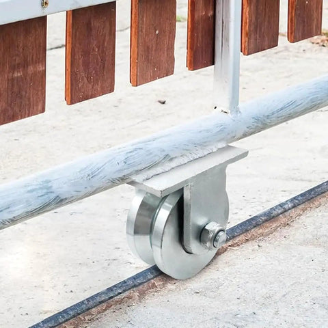 Knockout 4 Inch Galvanized Steel V Groove Gate Wheel With Welded Bracket Handles 3000 Pounds Loaded Down Hard With Premium Sealed Bearings To Roll Open Heavy Barn Doors Without Breaking A Sweat Ever, mounted on sliding gate.