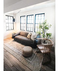 One Light Pendant In Metal Finish With Modern Industrial Style for living room, view of black pendant near couch and windows