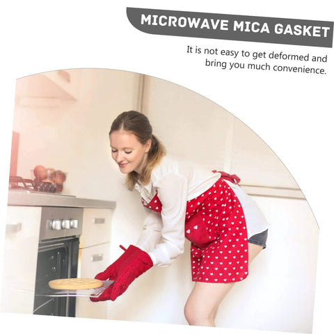 Woman using oven with Set Of 10 Mica Sheets For Microwave Oven Waveguide Insulation Heat Resistant Kitchen Must Have Accessory.