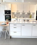 Modern kitchen with white cabinets featuring 12 Pack 5 Inch Arch Cabinet Pulls In Gold And Black Zinc Alloy And Aluminum Handles