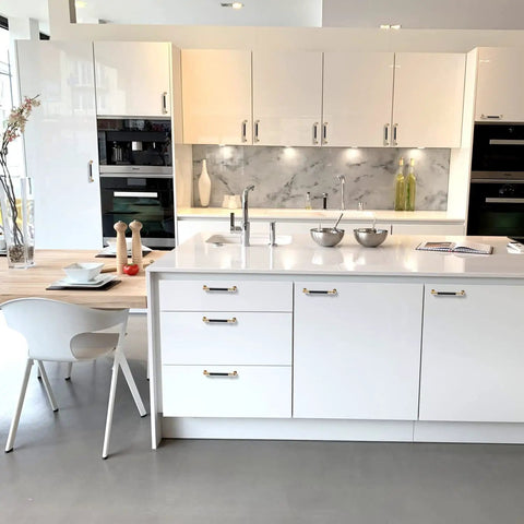 Modern kitchen with white cabinets featuring 12 Pack 5 Inch Arch Cabinet Pulls In Gold And Black Zinc Alloy And Aluminum Handles