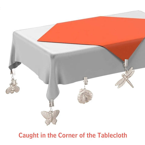4 Pack Tablecloth Weights With Metal Clips Clamps For Outdoor Parties And Picnics displayed on a table corner