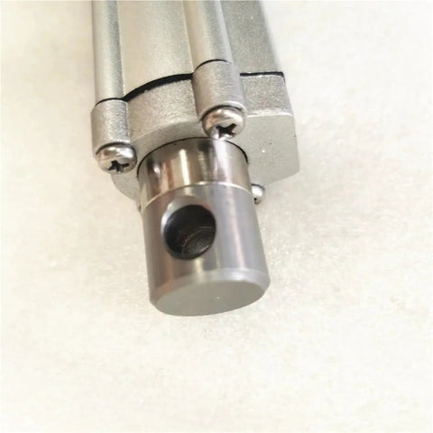 Close-up of 12 Volt Linear Actuator With Potentiometer Dialed In For Precise Motion Control showing metallic piston and screws.