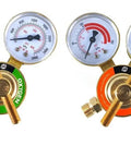 Pair of welding gas regulators with gauges for oxygen (green) and propane (orange) front view.