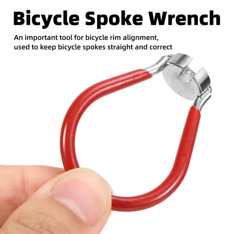 Hand holding part of 5-Piece Universal Bicycle Spoke Wrench Set With Tire Lever, close-up of metal slot wrench with red handle.