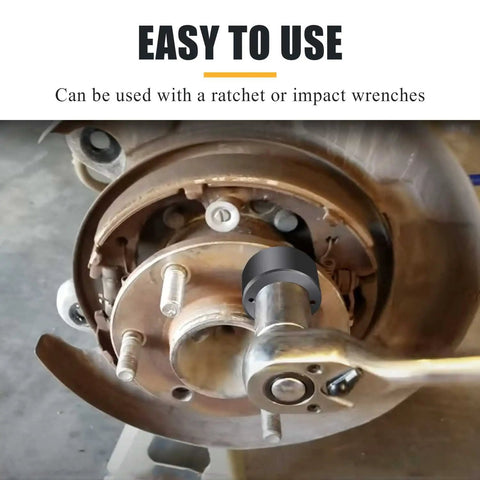 Wheel Stud Installer Tool Replacement 22800 for light-duty trucks in use with a ratchet on a rusty wheel hub