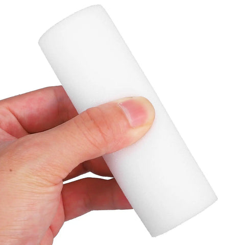 Close-up of a hand holding a small white sponge roller. 10 Piece Small Sponge Paint Rollers With Slick Plastic Grips And Dense Texture Sleeves For No Fuss Wall Painting Easy Rinse Reusable Build Perfect For Quick Home Refresh Jobs.