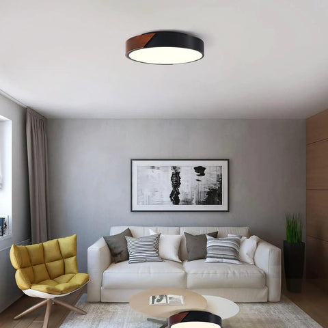 Living room with Slick Modern Black Wood Look Flush Mount Ceiling Light 3 Light Fixture, round and dimmable, no bulbs included.
