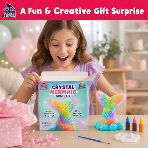 Mermaid Crystal Growing Kit For Kids 6 To 8, STEM Craft Toy That Grows Sparkling Crystals On A Mermaid Tail, Totally Screen-Free, Hands-On Science And Art Project For Young Scientists. Girl holding crystal mermaid craft kit box